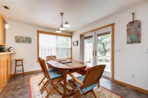 a dining room with a wooden table and chairs at Beachcomber's Paradise in Pacific City