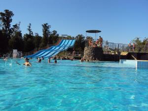 a group of people in the water at a water park at Emanapartmanok Sárvár in Sárvár