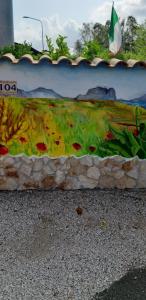 a wall with a painting on the side of it at Casale Del Borgo in Hermada