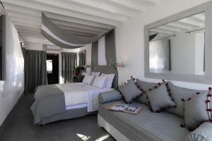 a bedroom with a bed and a couch at Dar Seven in Marrakesh
