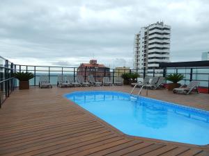 a swimming pool on the roof of a building at Life Hotel Torres in Torres