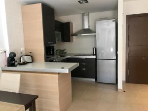 A kitchen or kitchenette at El Mocan Luxury Apartment