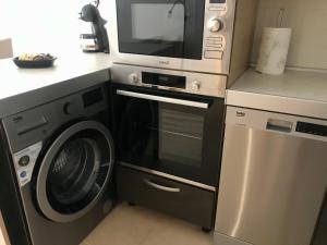 A kitchen or kitchenette at El Mocan Luxury Apartment
