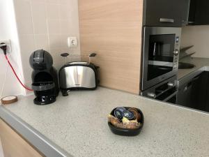 A kitchen or kitchenette at El Mocan Luxury Apartment