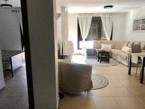 A seating area at El Mocan Luxury Apartment