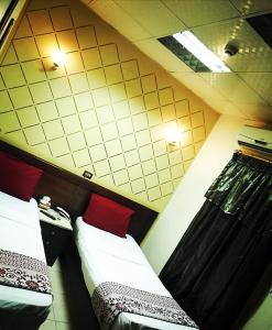 Cama o camas de una habitación en فندق جراند كليوباترا المحلة