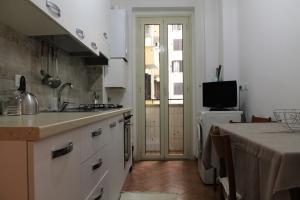 a kitchen with a sink and a counter top at Rhome202 in Rome