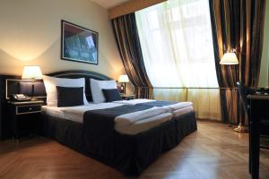 Posteľ alebo postele v izbe v ubytovaní Elysee Hotel