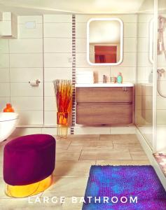 a bathroom with a sink and a mirror at Apartment Duplex with Sauna City- Center Cathedrale in Strasbourg