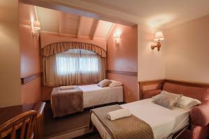 Postel nebo postele na pokoji v ubytování Hotel Vista do Vale