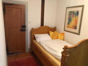 Un pat sau paturi într-o cameră la Maison Zielinger