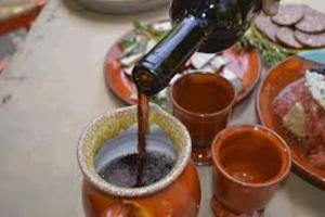 a person is pouring coffee into a cup on a table at Casa D'armaros in Kissamos