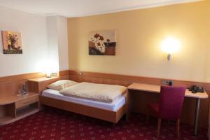 Postel nebo postele na pokoji v ubytování Hotel Restaurant Zum Hirschen