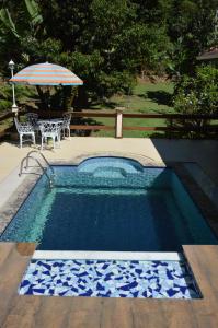 A piscina localizada em Pousada Ribeirao da Floresta ou nos arredores