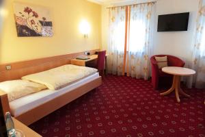 Postel nebo postele na pokoji v ubytování Hotel Restaurant Zum Hirschen