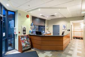 a lobby of a store with a cash counter at Ocean Promenade Hotel in White Rock