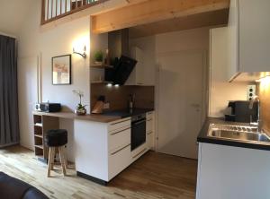 Kuchyň nebo kuchyňský kout v ubytování Leben!Pur - Alpenlofts + 13 fotografií