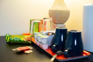 a table with a bunch of items on it at Accommodation Bristol Airport in Redhill
