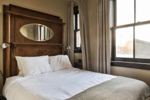 Postel nebo postele na pokoji v ubytování KEX Hotel