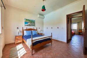 Postel nebo postele na pokoji v ubytování Quinta dos Pastores