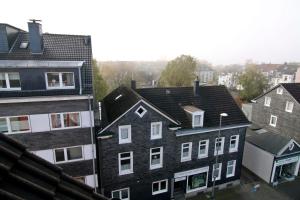 an aerial view of roofs of buildings in a city at apartmondo Apartmentwohnungen Remscheid in Remscheid