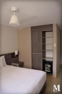 Letto o letti in una camera di Hotel Mega