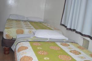 Postel nebo postele na pokoji v ubytování Hotel Paradise Beach