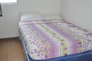 Postel nebo postele na pokoji v ubytování Hotel Paradise Beach