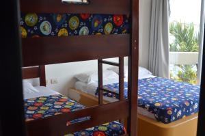 Postel nebo postele na pokoji v ubytování Hotel Paradise Beach