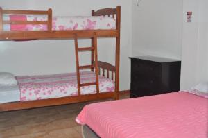Postel nebo postele na pokoji v ubytování Hotel Paradise Beach