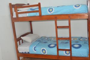Postel nebo postele na pokoji v ubytování Hotel Paradise Beach