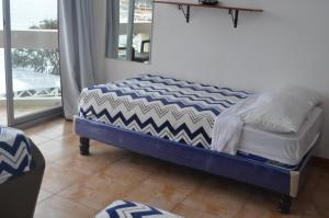 Postel nebo postele na pokoji v ubytování Hotel Paradise Beach