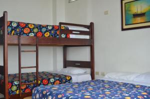 Postel nebo postele na pokoji v ubytování Hotel Paradise Beach