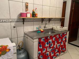 a kitchen with a sink and a counter top at Casa do Cais in Abraão
