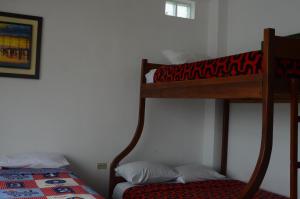 Postel nebo postele na pokoji v ubytování Hotel Paradise Beach