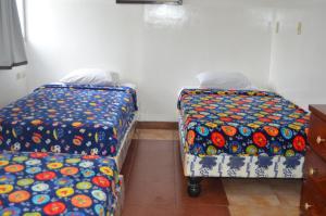 Postel nebo postele na pokoji v ubytování Hotel Paradise Beach