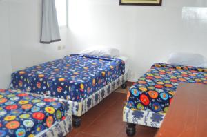 Postel nebo postele na pokoji v ubytování Hotel Paradise Beach