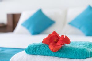 Voodi või voodid majutusasutuse At Ease Beach Hotel toas