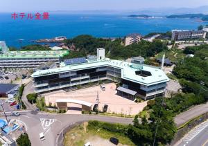 an aerial view of a building with the ocean in the background at Grampus Sea in Shirahama