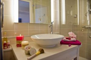 a bathroom with a white bowl sink on a counter at Hôtel Miléade La Frégate - Bidart in Bidart