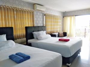 Voodi või voodid majutusasutuse Jos & Hanny Homestay toas