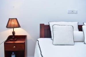 Letto o letti in una camera di Minuri Villa