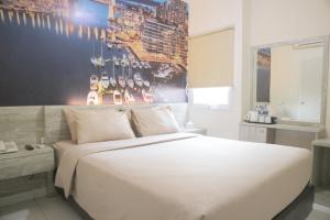 Letto o letti in una camera di De Green Inn @aeropolis