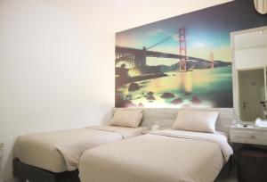 Letto o letti in una camera di De Green Inn @aeropolis
