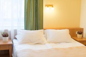 Postel nebo postele na pokoji v ubytování Hotel Vita