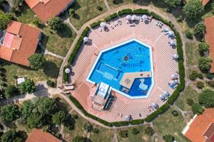 an overhead view of a swimming pool in a yard at Holiday Centre Bi village in Fažana