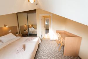 Postel nebo postele na pokoji v ubytování Hotel Vita