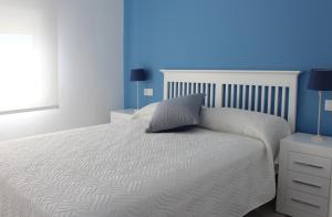 Ένα ή περισσότερα κρεβάτια σε δωμάτιο στο Villa La Costa - 3 apartamentos turísticos