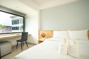 เตียงในห้องที่ Meesuk ChiangRai Hotel, SHA Certified