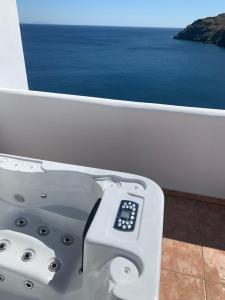 a view of the ocean from a balcony at Caldera Studios in Astypalaia Town